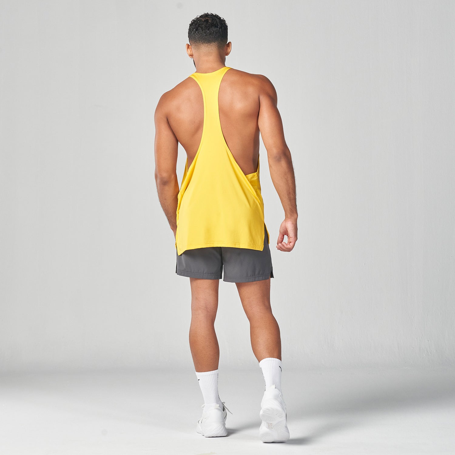 squatwolf-gym-wear-essential-gym-stringer-yellow-stringer-vests-for-men